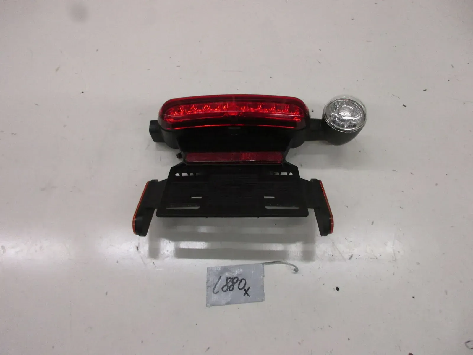 Kennzeichenhalter Rücklicht L880. Harley Davidson Sportster S Blinker 69202043 - Bild 1