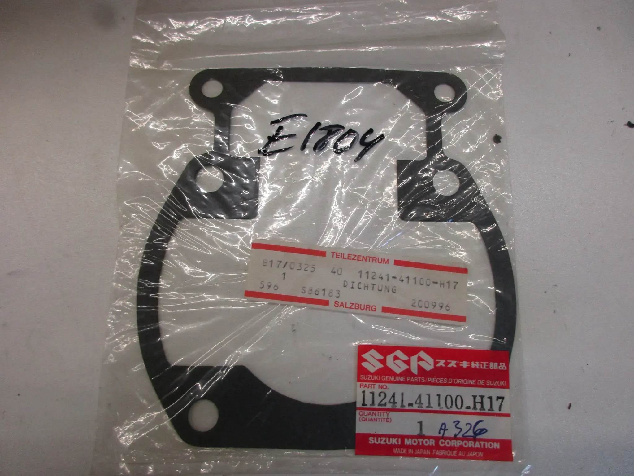 E1804. Suzuki TS 250 ER Dichtung Zylinderfußdichtung 11241-41100-H17 Motordichtung - Bild 1